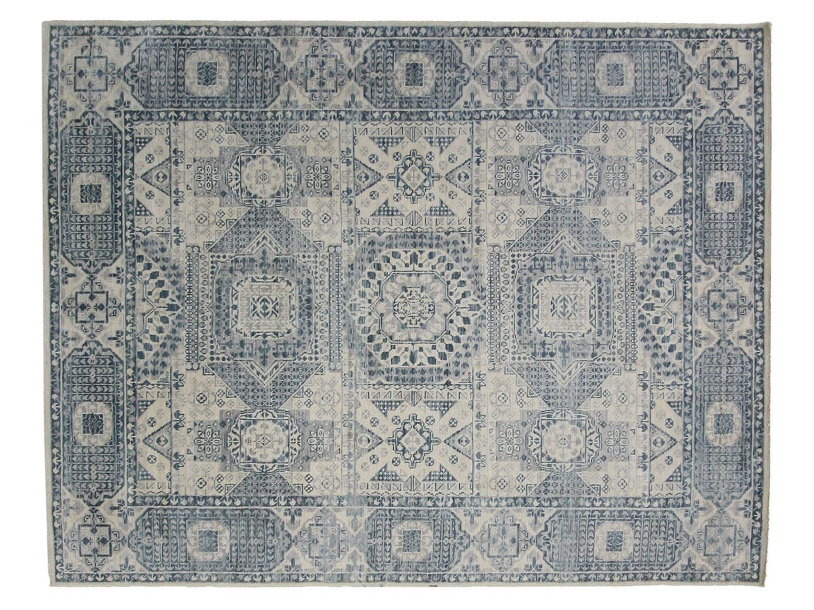 9x12 Turkish Anatolian rug with a transitional tribal design in blue and soft ivory, made from premium hand-spun wool.