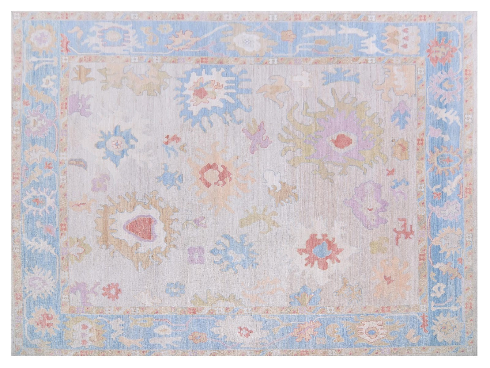 9x12 Faberge rug in transitional design featuring pinks, blues, and oranges, framed by a light blue border, hand-knotted in 100% wool