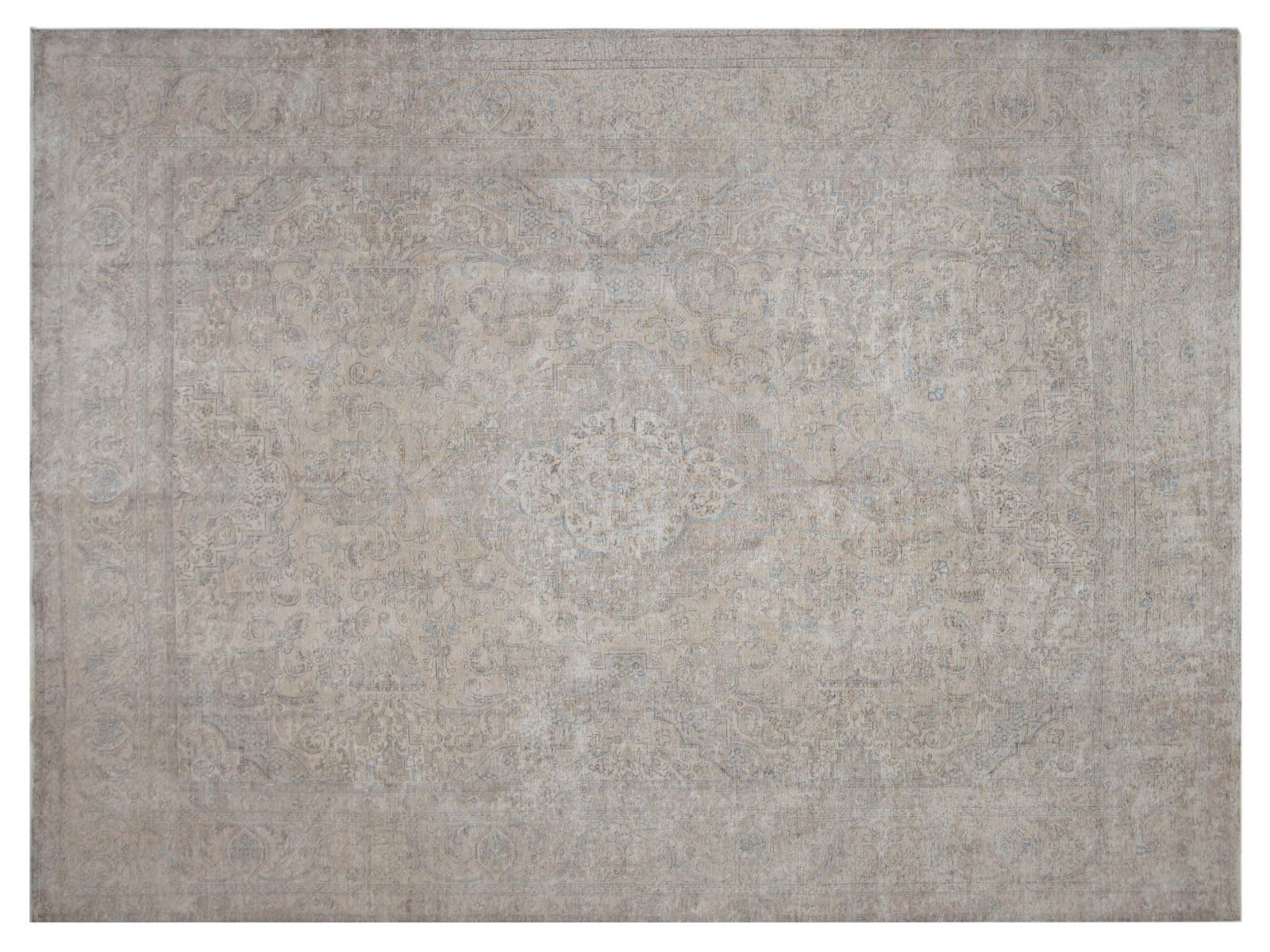 Oversize vintage Persian rug with a faded medallion design and subtle motifs, embodying over 80 years of history.