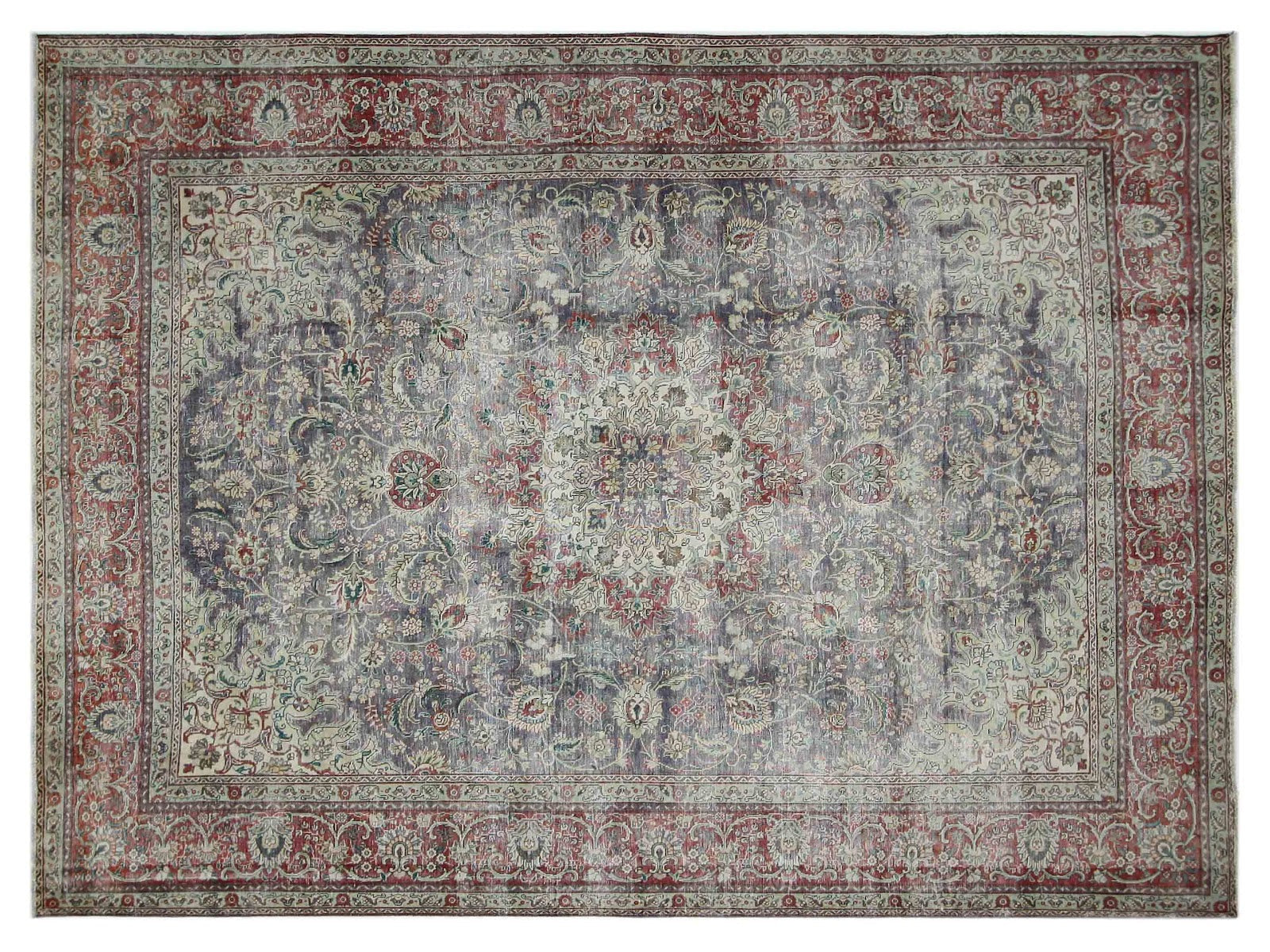 9x12 vintage Tabriz rug with faded blues and reds surrounding a classic medallion, hand-knotted in 100% wool