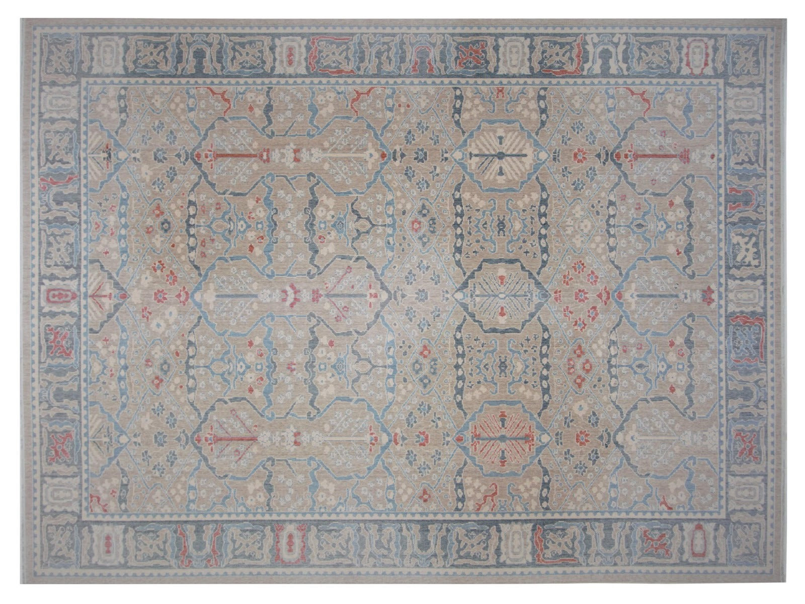 Oversize transitional wool rug hand-knotted with a neutral palette, highlighted by subtle touches of red and blue
